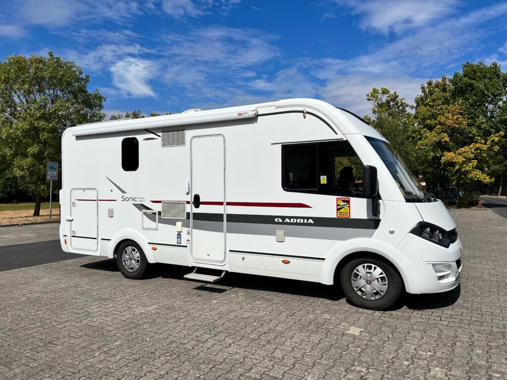 A white motorhome in a car park