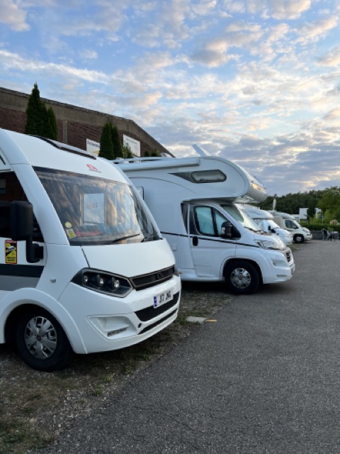 A row of Motorhomes are parked up on a Stellplatz in Germany